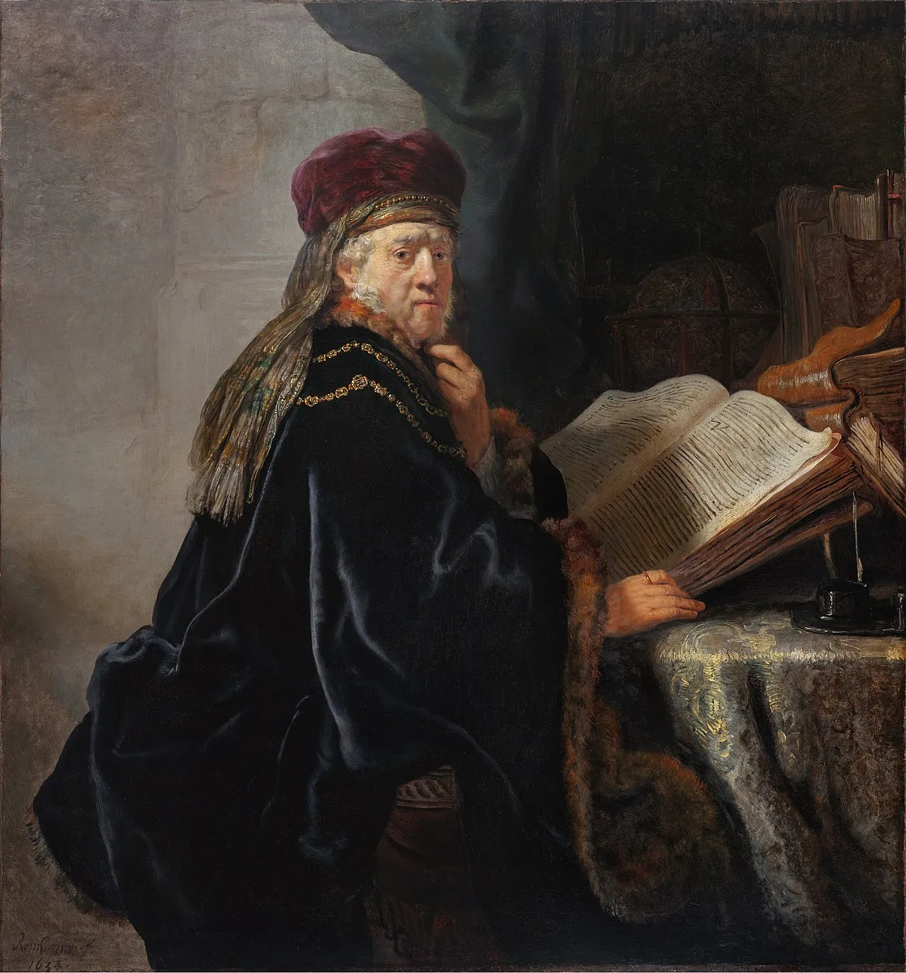 Rembrandt van Rijn, A Scholar in His Study (1634), Sternberg Palace, Prague. A bearded sage in a deep blue robe and burgundy beret rests his hand at his chin in quiet contemplation, the classic image of inward observation and the examined mind